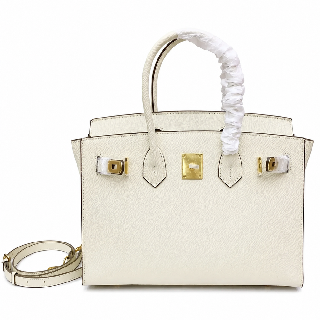Pale Chalk Off-White Fine Grain Sharp Seam Compact Trapezoid Tote With Warm Golden Twist Lock Hardware And Matching Detachable Carry Strap Leather