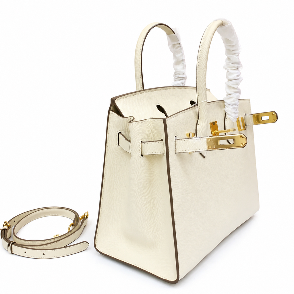 Pale Chalk Off-White Fine Grain Sharp Seam Compact Trapezoid Tote With Warm Golden Twist Lock Hardware And Matching Detachable Carry Strap Leather